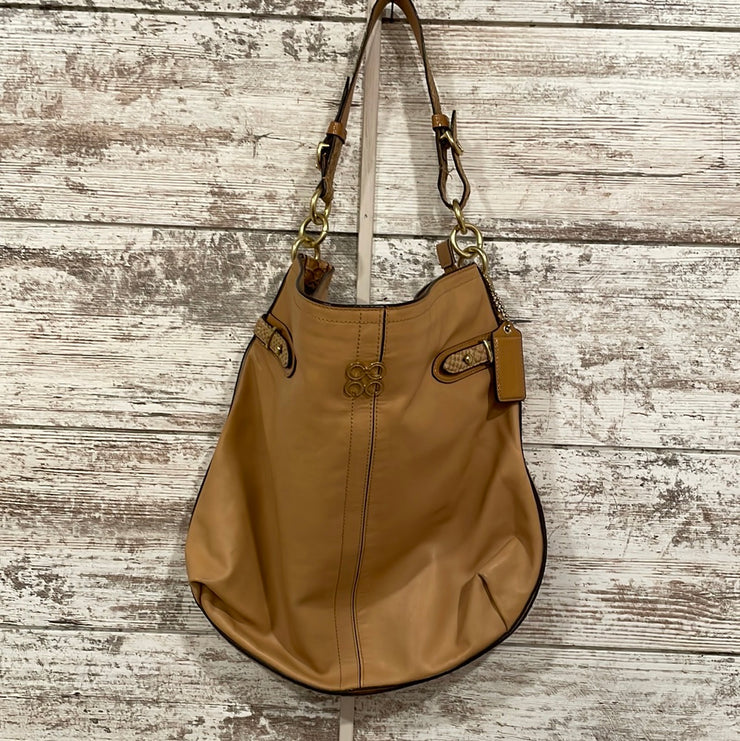 TAN LEATHER HANDBAG $398