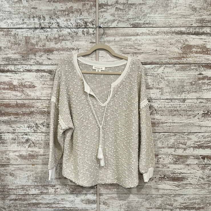 IVORY SWEATER WITH TASSLES