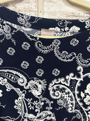 NAVY/WHITE FLORAL TOP $129